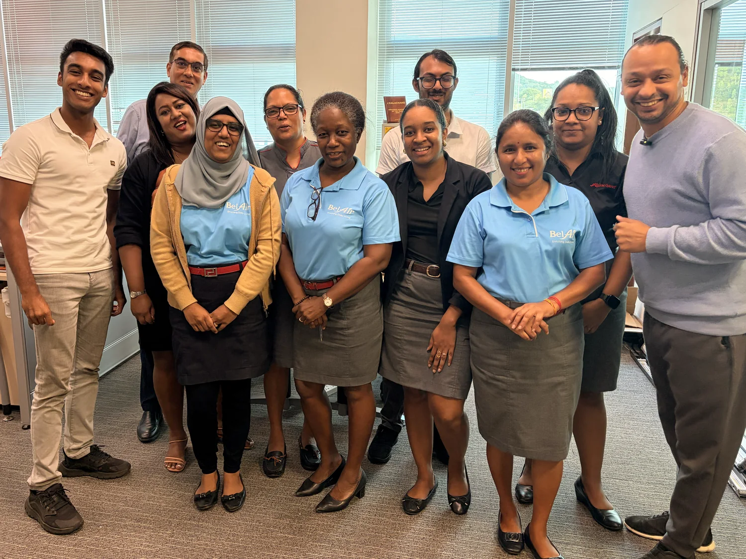 A Mauritian company team with Island AI after an on-site session.